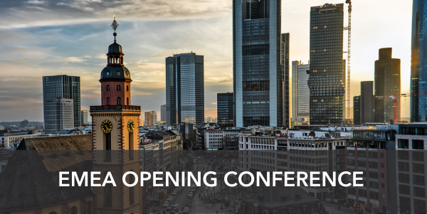 Banner: EMEA opening conference. The picture in the back is a skyline of Frankfurt where there is a contrast between the old and new buildings