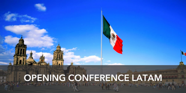 Banner: Opening LATAM conference. Picture in the back is the main place downtown in Mexico df with the mexican flag